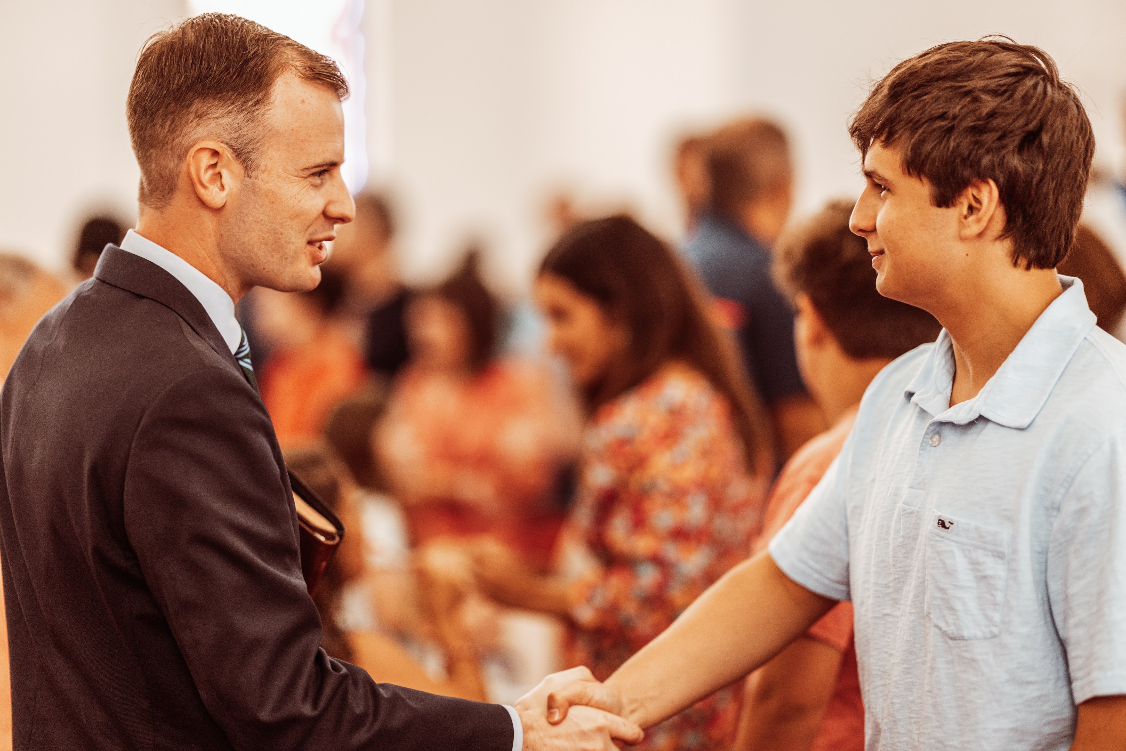 Pastor greeting and evangelizing after service