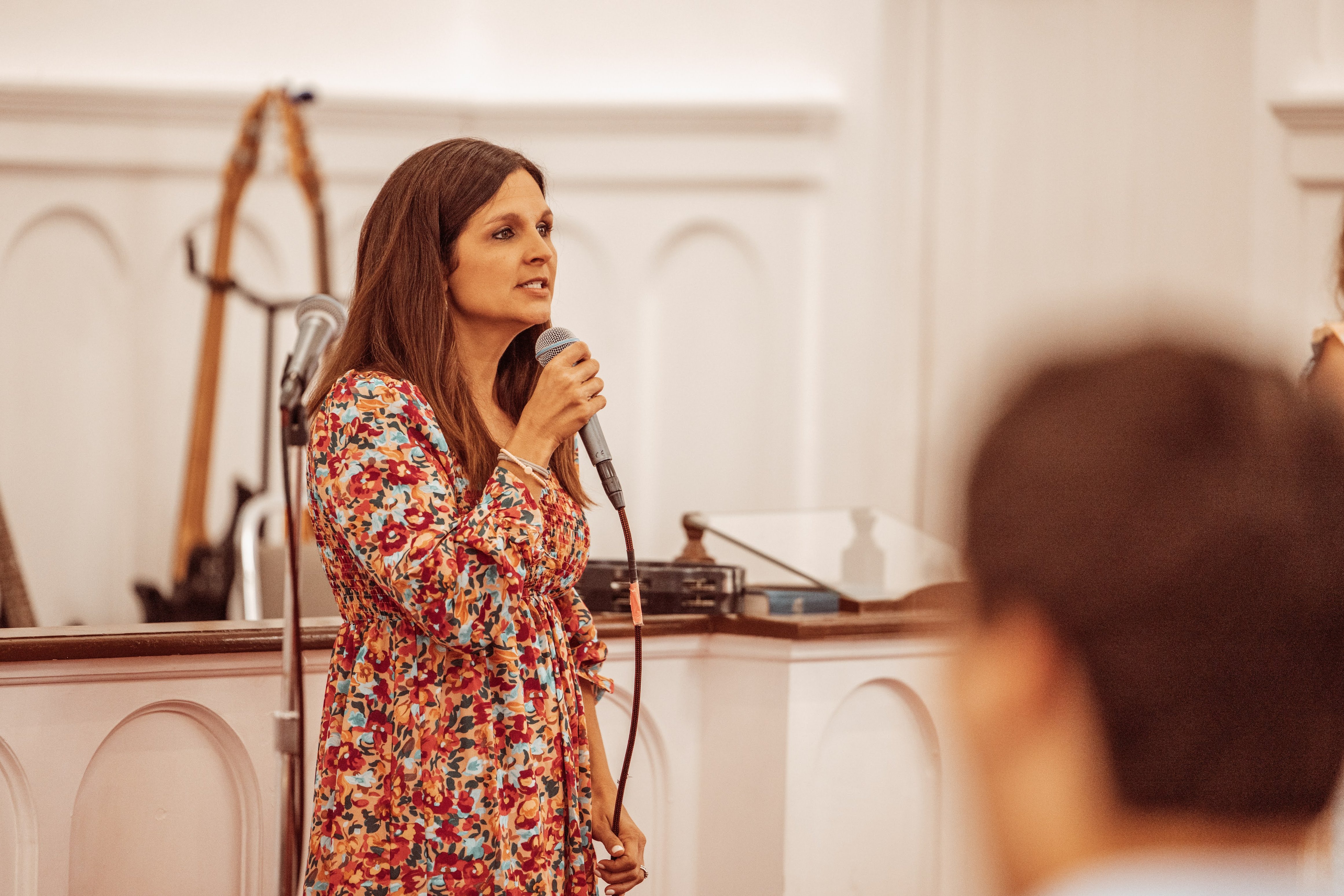 Woman speaking at church ministry event
